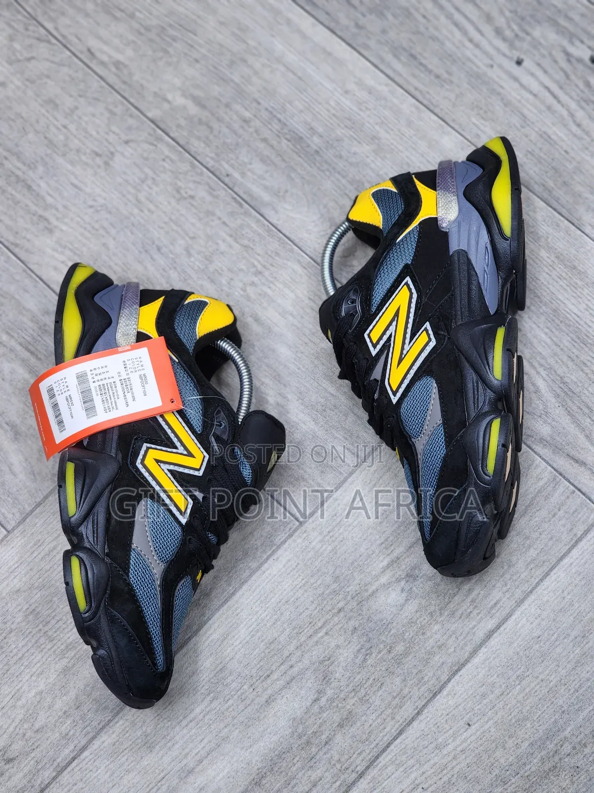 New Balance 9060 Sneakers In A Black, Grey, And Yellow