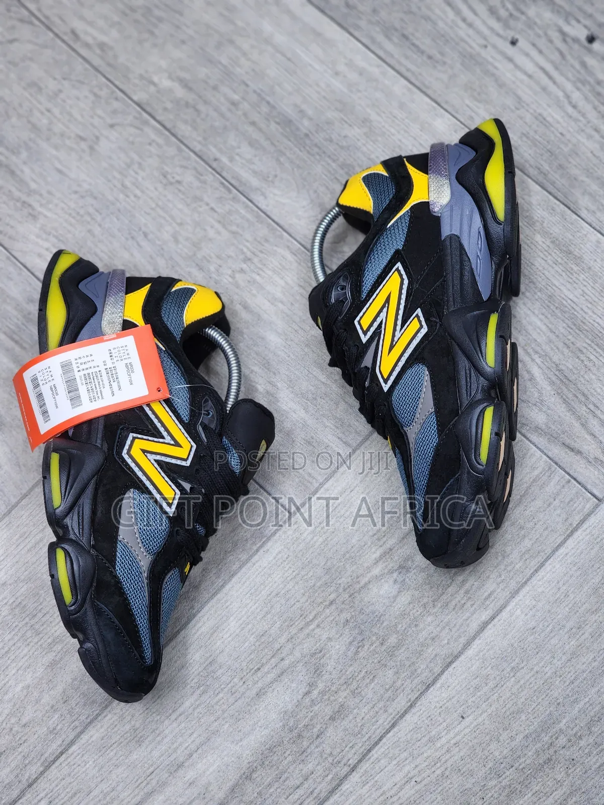 New Balance 9060 Sneakers In A Black, Grey, And Yellow