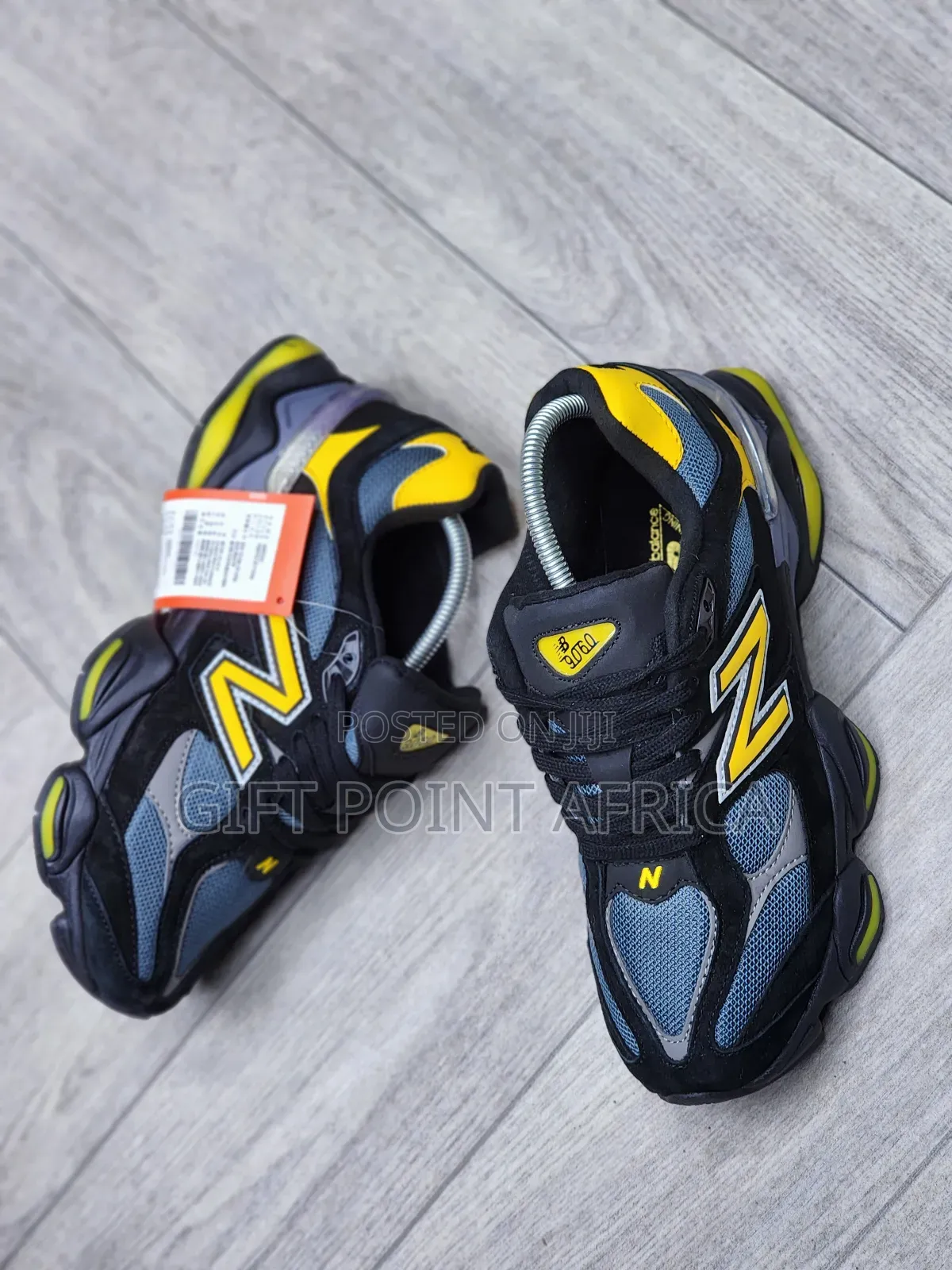 New Balance 9060 Sneakers In A Black, Grey, And Yellow