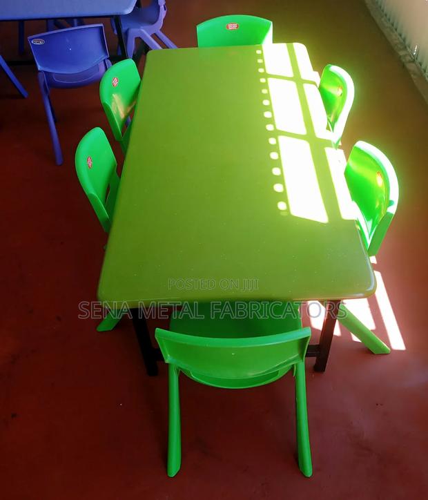 Plastic Kindergarten Chairs and a Table in Green .