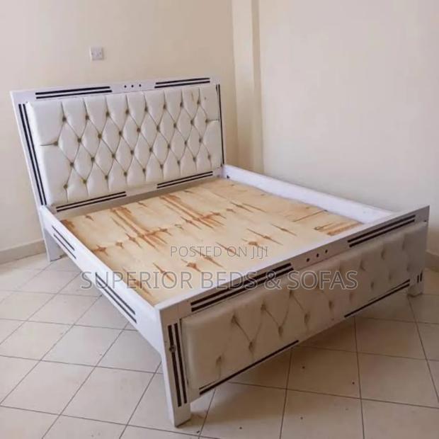 White Tufted Upholstered Bed Size 5 by 6. - main view