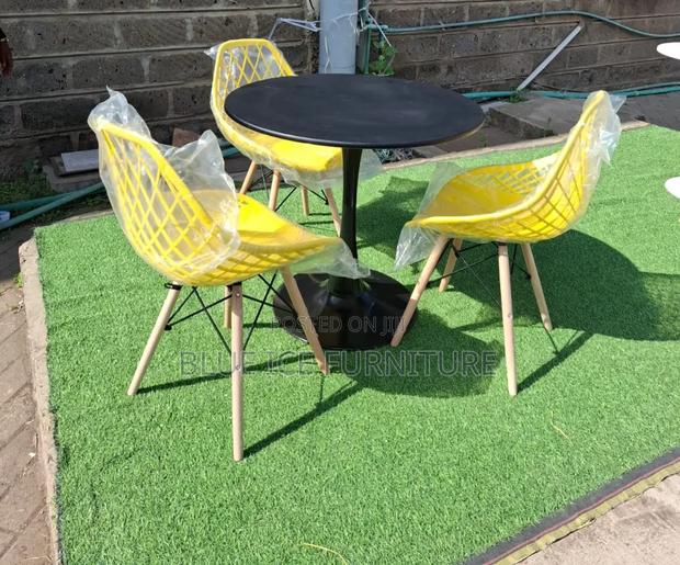 Black Round Dining Table and Chairs - main view