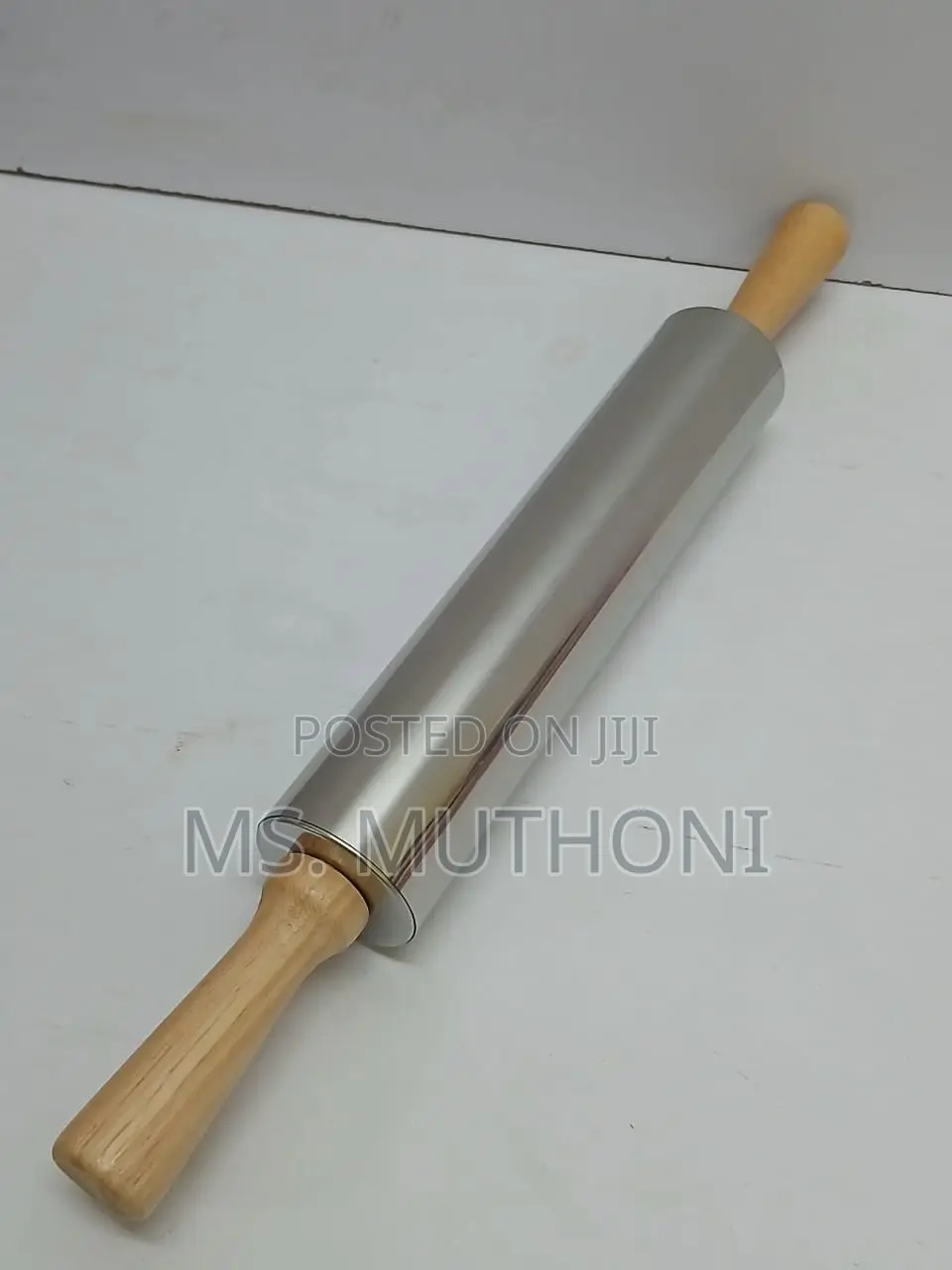 Stainless Steel Non-Stick Rolling Pin With Wooden Handles.