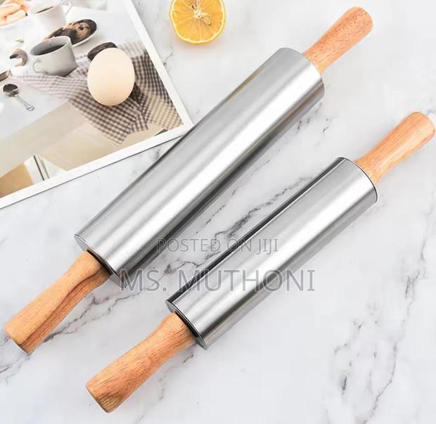 Stainless Steel Non-Stick Rolling Pin With Wooden Handles.