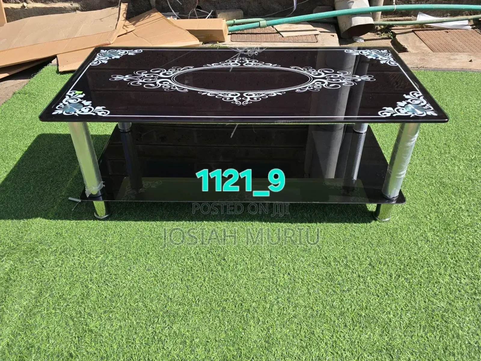 Modern Black Glass Coffee Table With White Ornamental Patterns