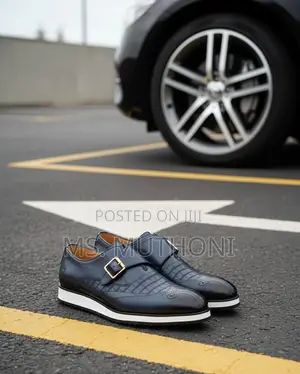 Monk Strap Dress Shoes With a White Sole and a Gold-Tone Buckle.
