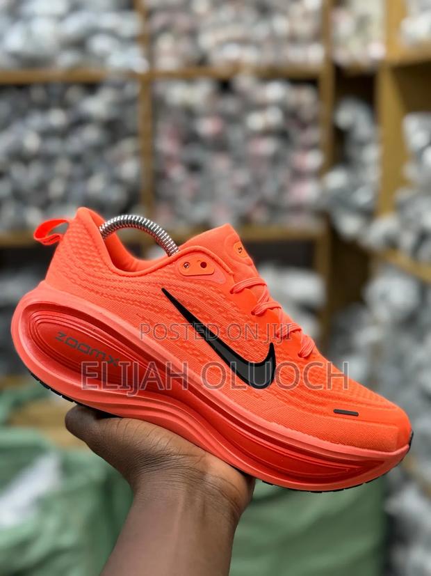 Nike Vomero Plus Running Shoe in the "Orange Pulse" - main view