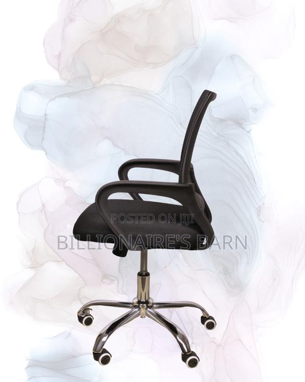 Black Compact Ergonomic Chair | Rolling Comfort for Busy Workdays |