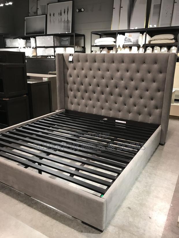 Elegant Gray Tufted Bed With Low Back - main view