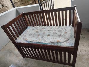 Wooden Baby Cot With an Adjustable Side Panel - main view