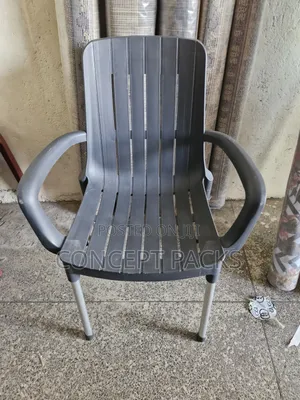 Black Modern Plastic Chair W/ Metal Tubing Legs.