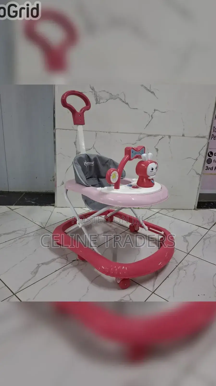 Baby Walker With a Push Handle and Built-in Music and Toys.