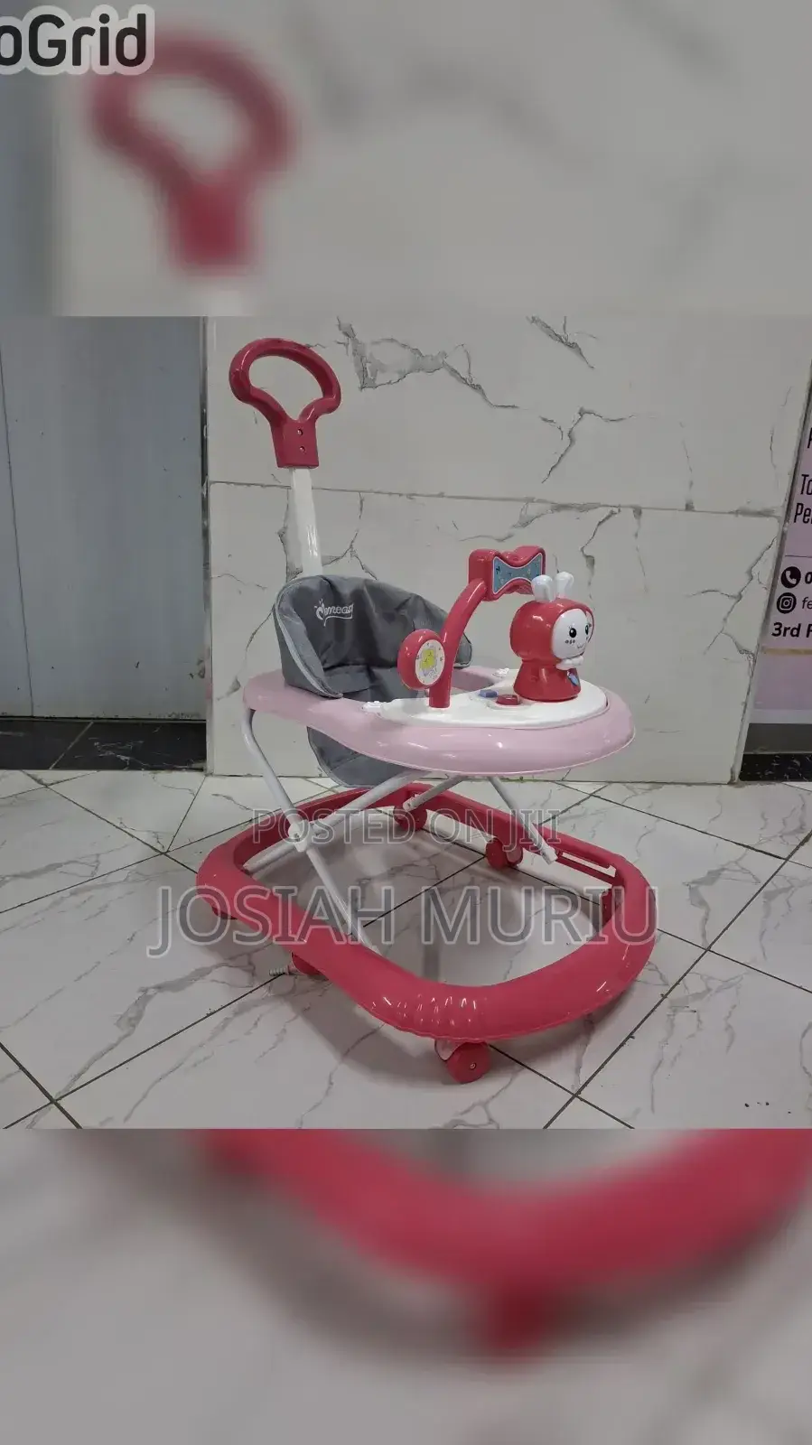 Baby Walker With a Push Handle and Built-in Music and Toys.