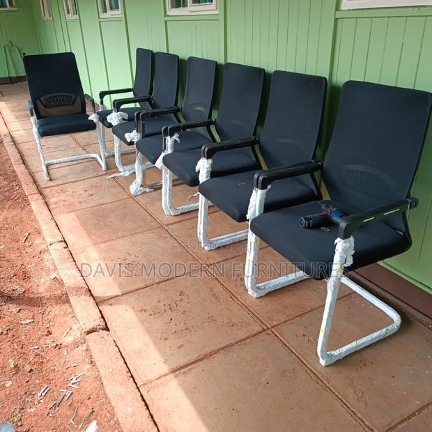 Modern Set of Black Office Chairs With Armrests - main view