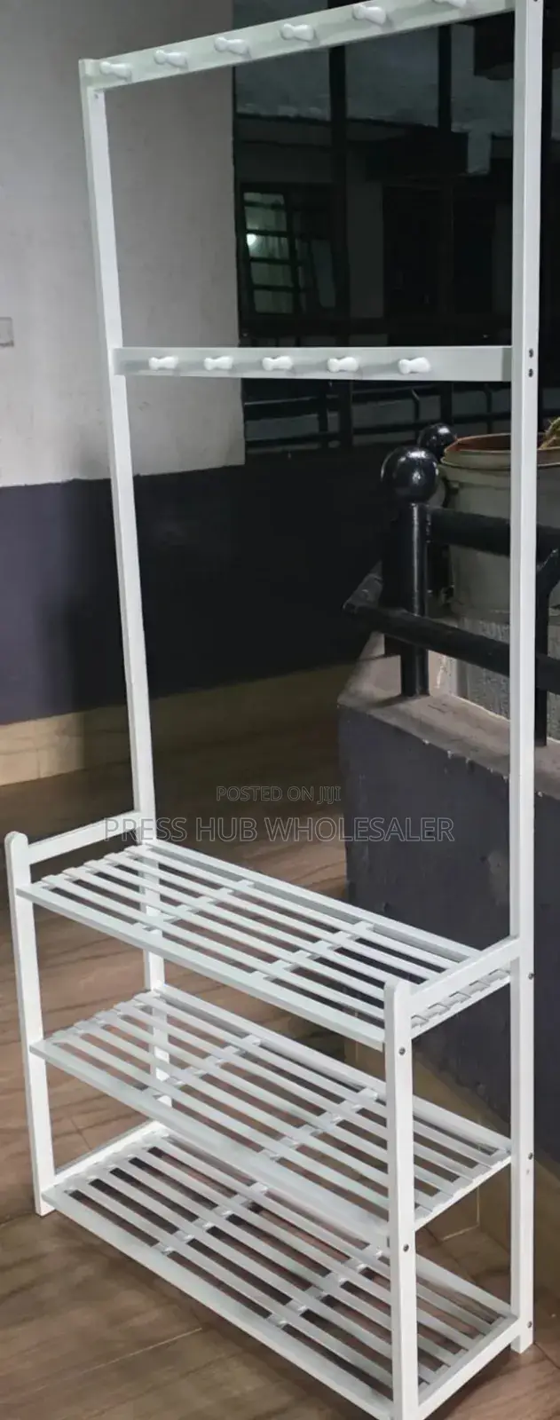 Multifunctional Bamboo Garment Rack With Shelves and Hooks.
