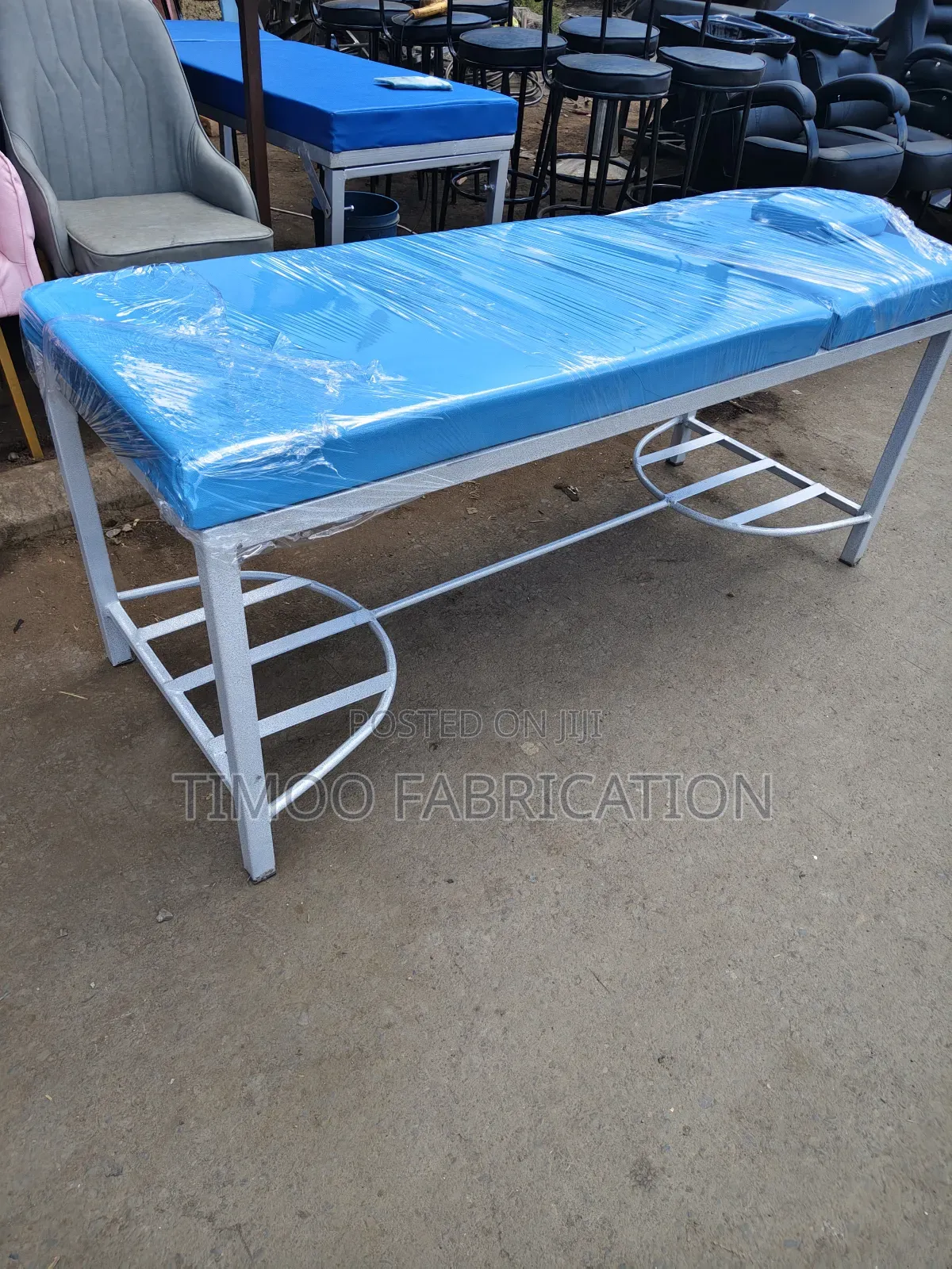 Massage Bed With Navy Blue and White Paint on Frame