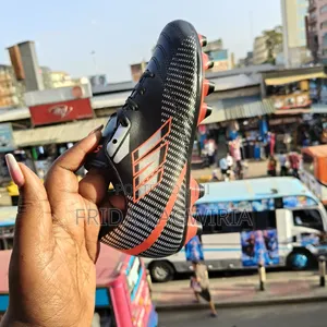 Durable Kids Football Boots For Turf And Pitch