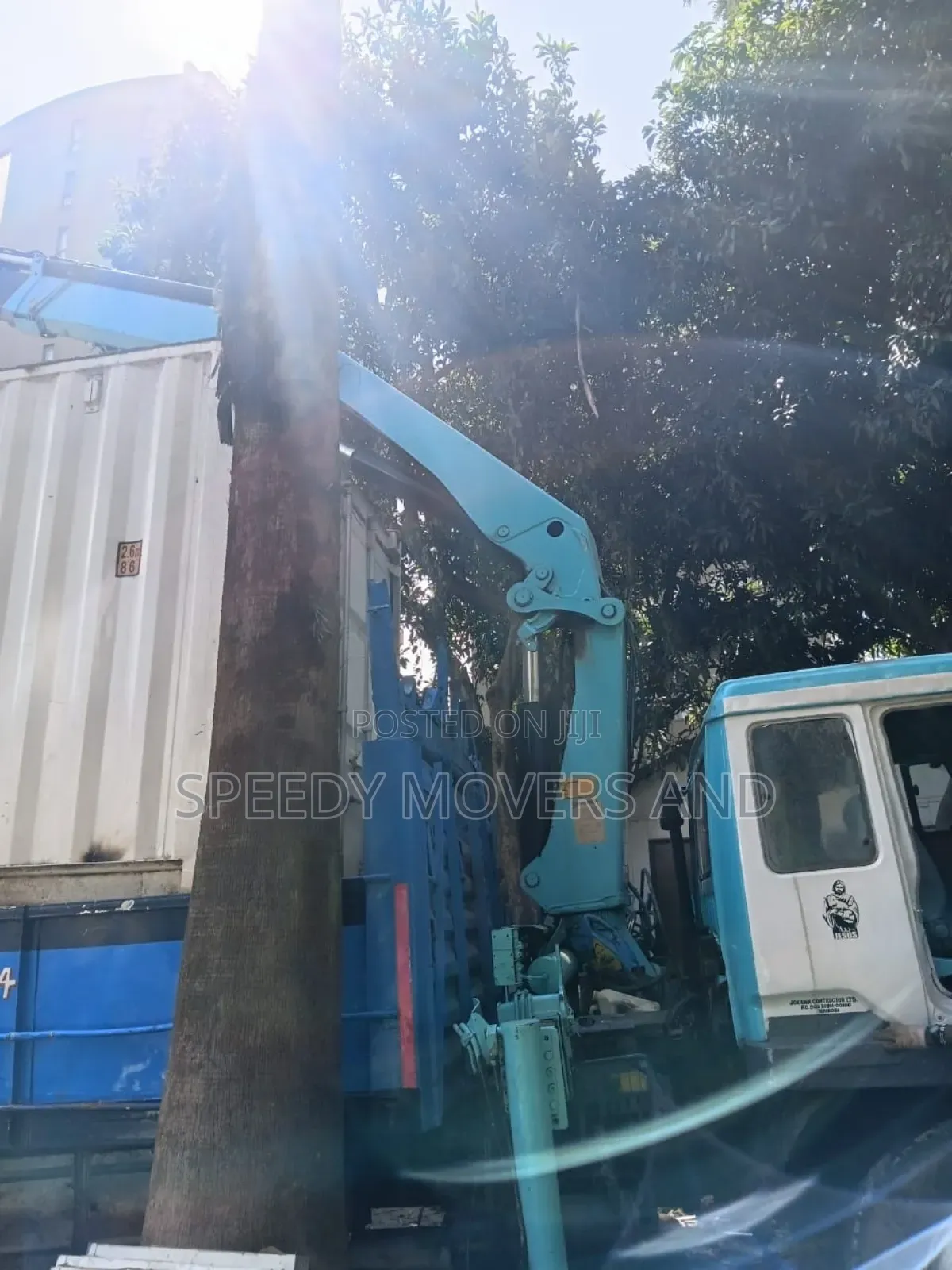 Trucks With Hoisting Cranes Are Available for Delivery and Logistics