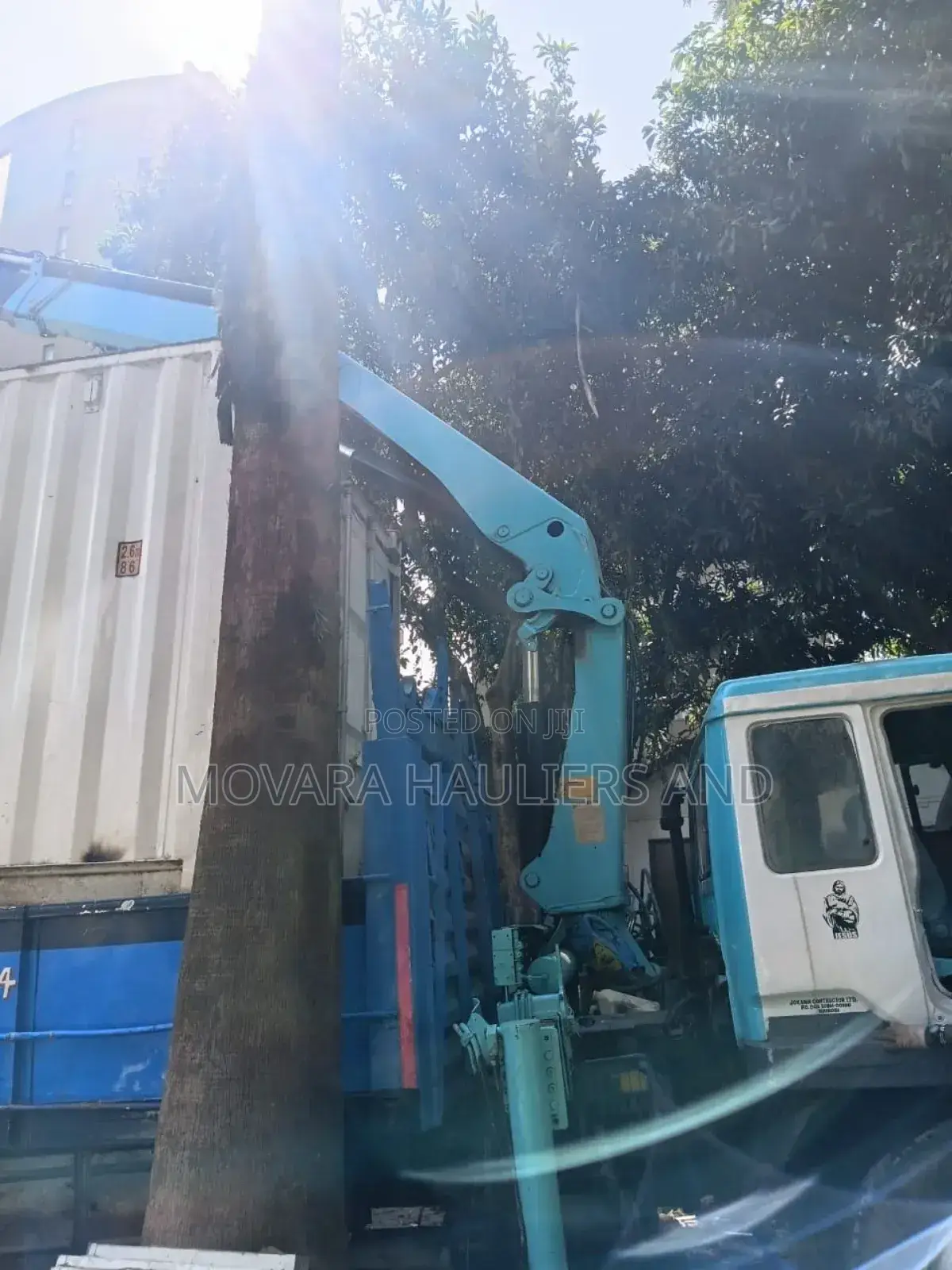 Trucks With Hoisting Cranes Are Available for Delivery and Logistics