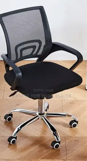Black Mesh Secretarial Office Chair With a Chrome Base.