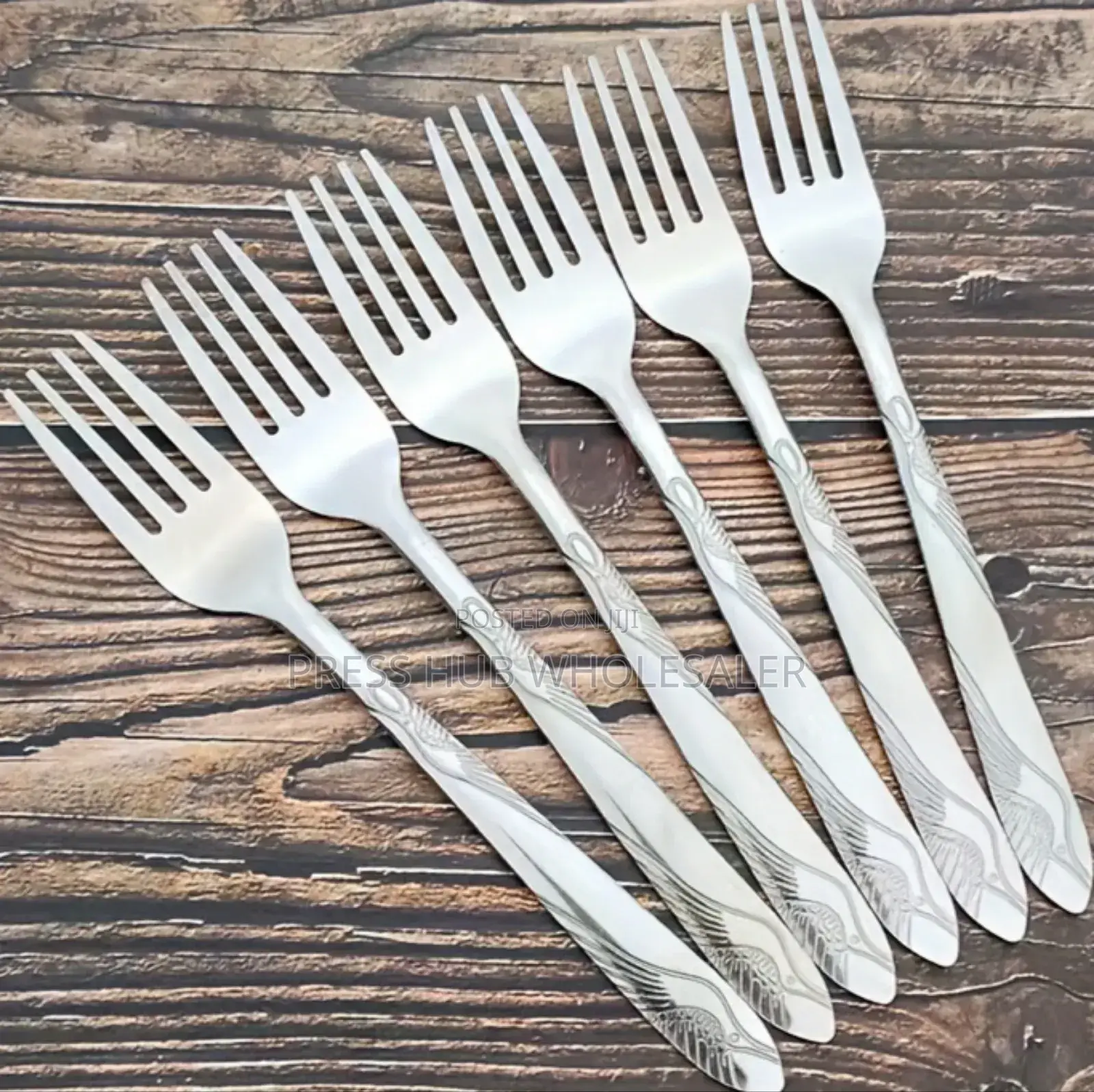 Six Heavy-Gauge Stainless Steel Dinner Forks." 