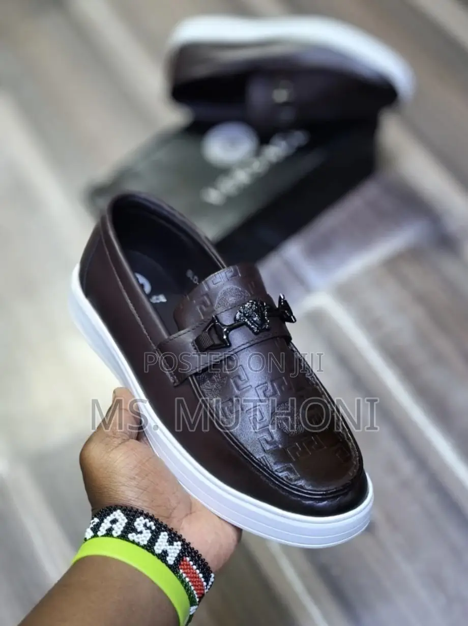 Versace Loafer With a White Sole and a Gold-Tone Medusa Head Bit