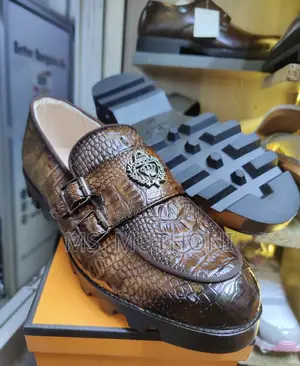 Crocodile-Textured Double-Monk Strap Loafers With a Chunky Lug Sole.