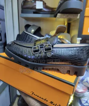 Crocodile-Textured Double-Monk Strap Loafers With a Chunky Lug Sole.
