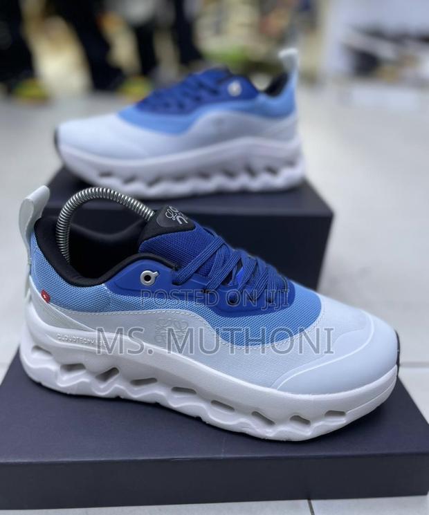 On Cloudtilt Running Shoe in the "Aqua/Iron" Blue White Colorway.