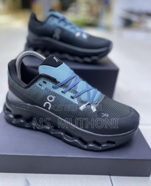 On Cloudtilt Running Shoe in the "Aqua/Iron" Blue White Colorway. - thumbnail 2