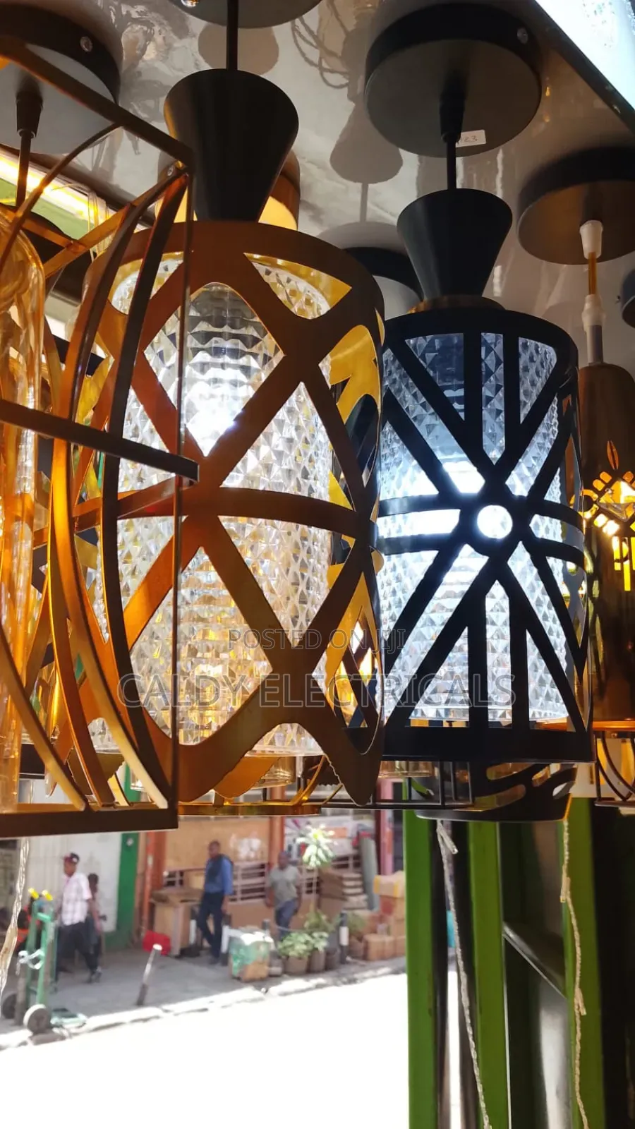 Modern Glass and Metal Pendant Lights With a Caged Design