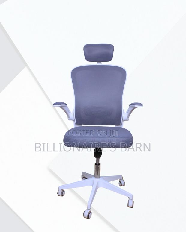 White Office Chair With Flip-Up Arms — Stable Base, Neck Support.