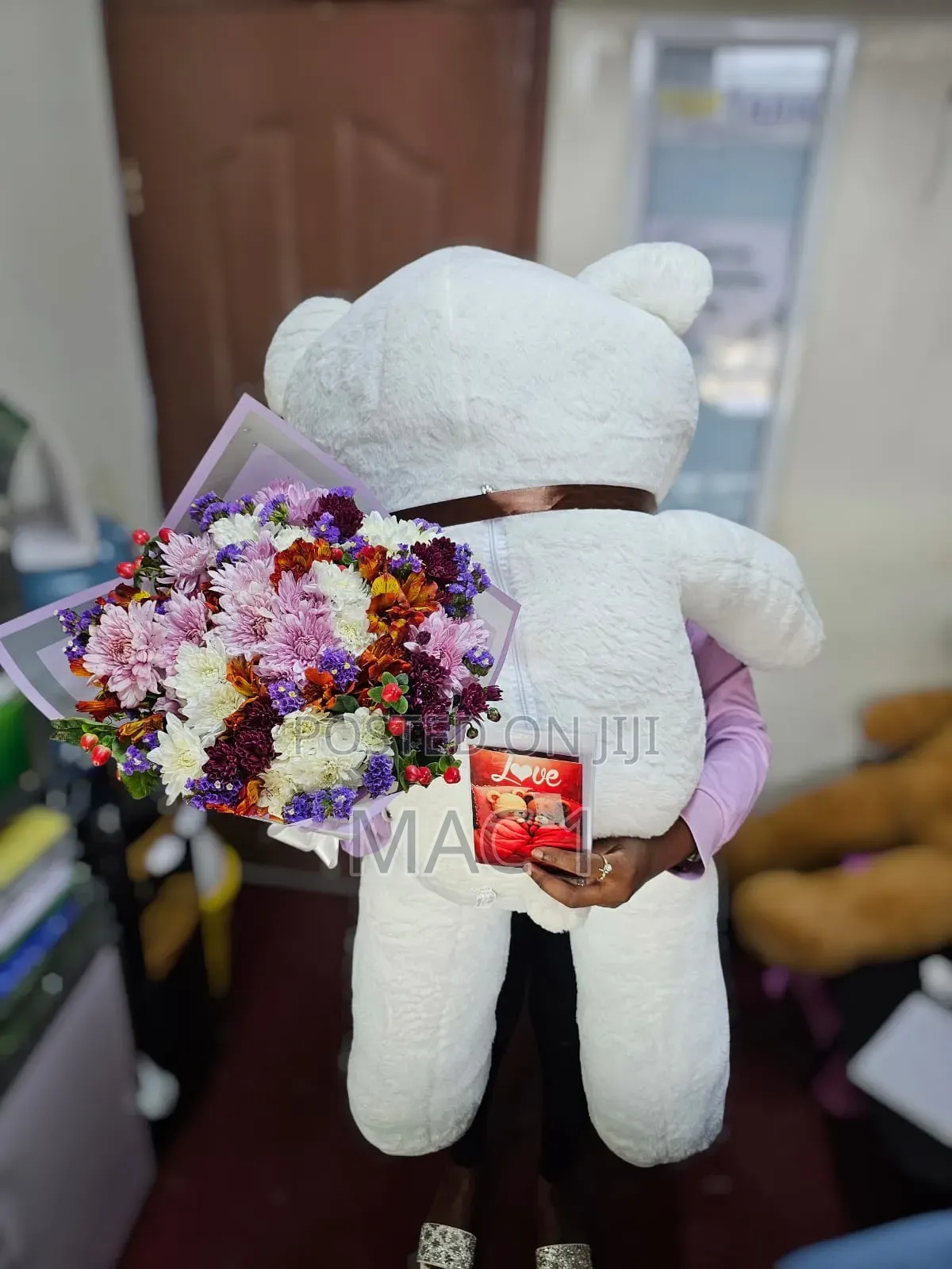Fancy Cute Teddy Bear With a Bunch of Flowers