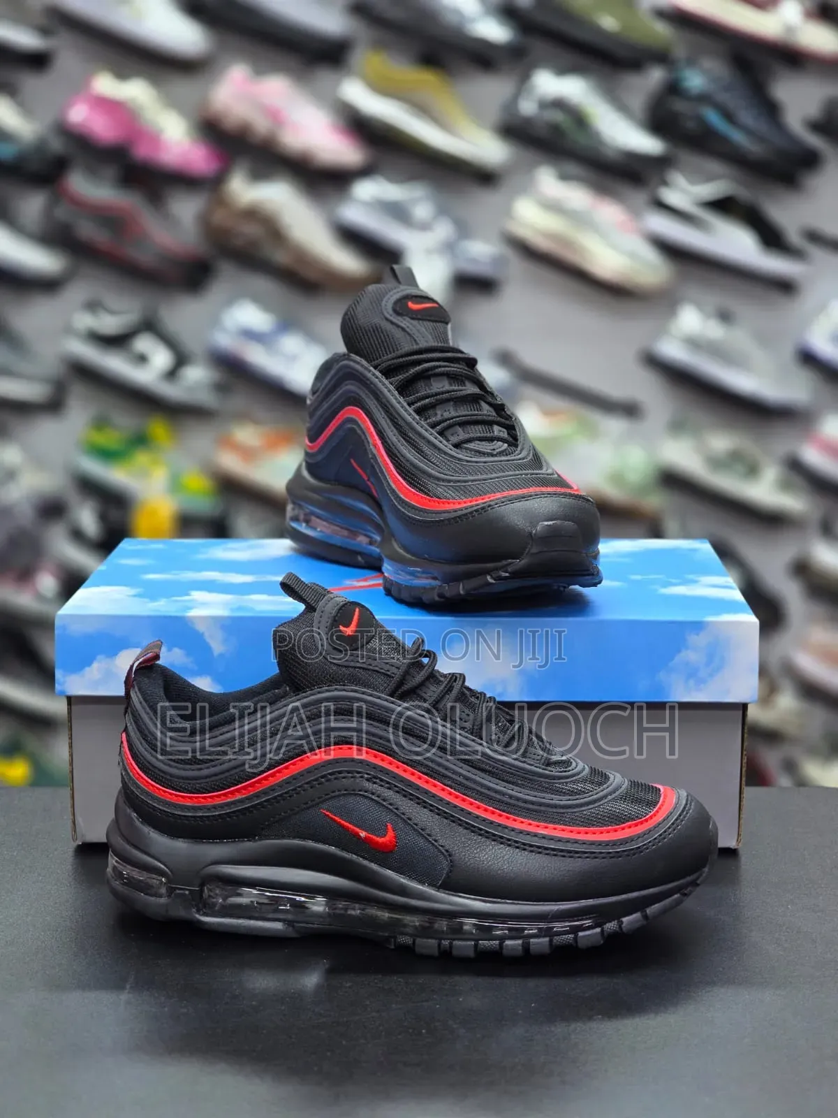 ￼

￼

This Is A Pair Of Nike Air Max 97s In A Black And Red