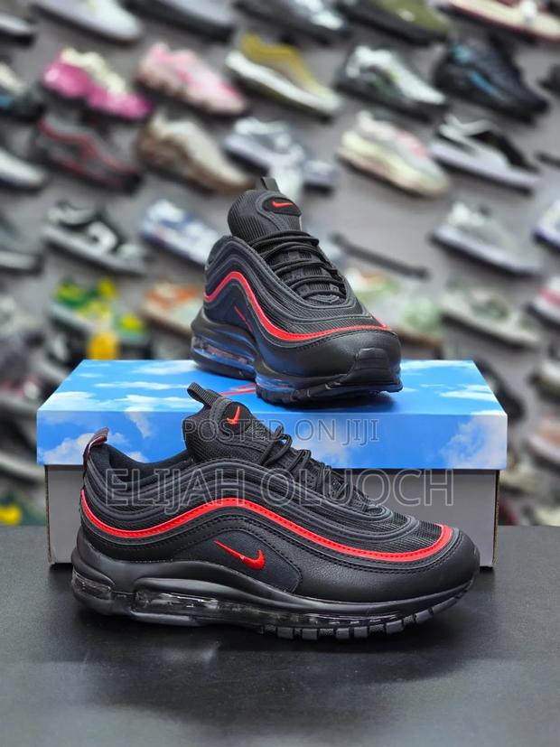 This Is A Pair Of Nike Air Max 97s In A Black And Red