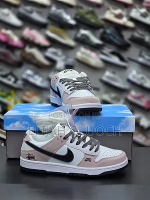 Stüssy X Nike Sb Dunk Low Sneakers In A White, Black, And Pink