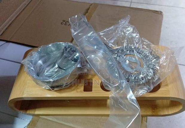 Cocktail Strainer and a Jigger, Part of a Bar Tool Set" 