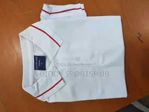Polo Shirt With Red Stripes on the Collar and Cuffs.