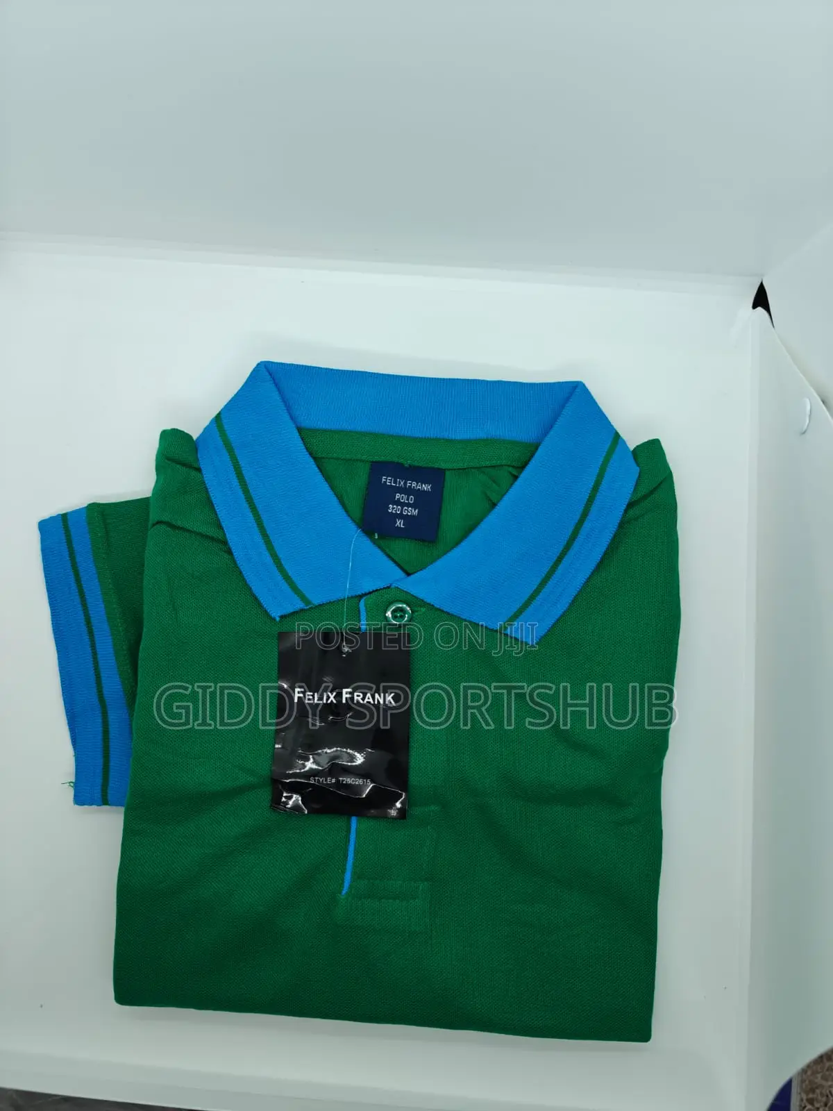 Green With a Blue Collar and Blue Striped Trim on the Sleeves.