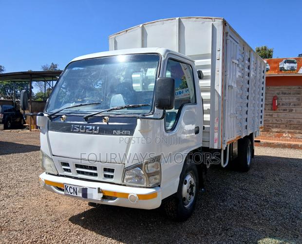 White Isuzu NKR - thumbnail 2