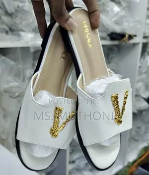 Versace Flat Sandals With a Gold-Tone v Logo Detail.