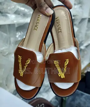 Versace Flat Sandals With a Gold-Tone v Logo Detail.