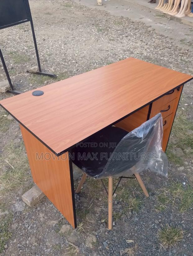 Office Desk and a Black Eames Chair - main view