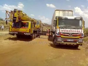 Transit Trailers With Hoisting Cranes Are Accessible Within Ngong