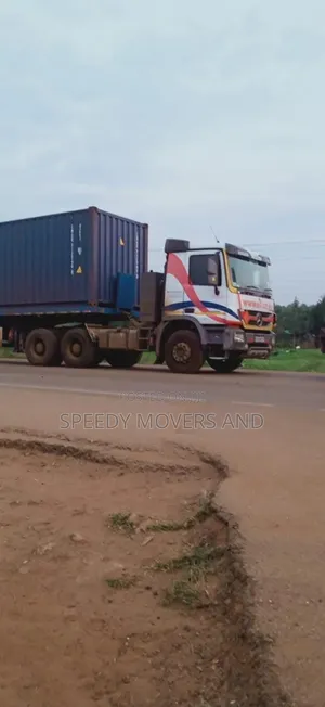 Transit Trailers With Hoisting Cranes Are Accessible Within Ngong