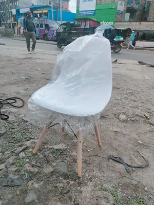 White Ottoman Eames Chair