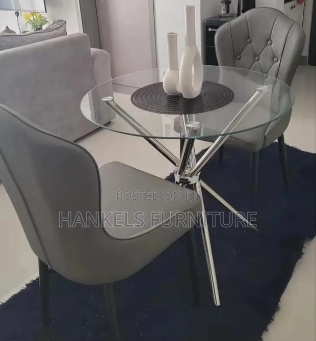 Stylish Round Glass Dining Set With Gray Chairs