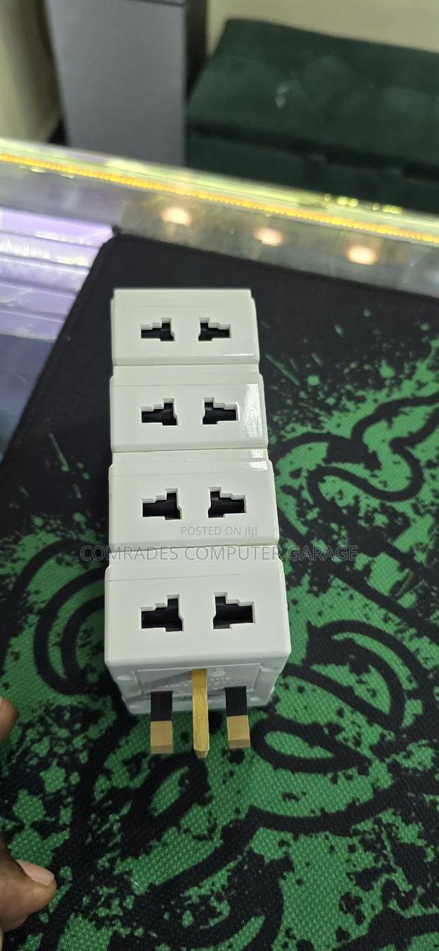3-Pin Uk Multiplug Adapter Which Also Functions Voltage Protector.