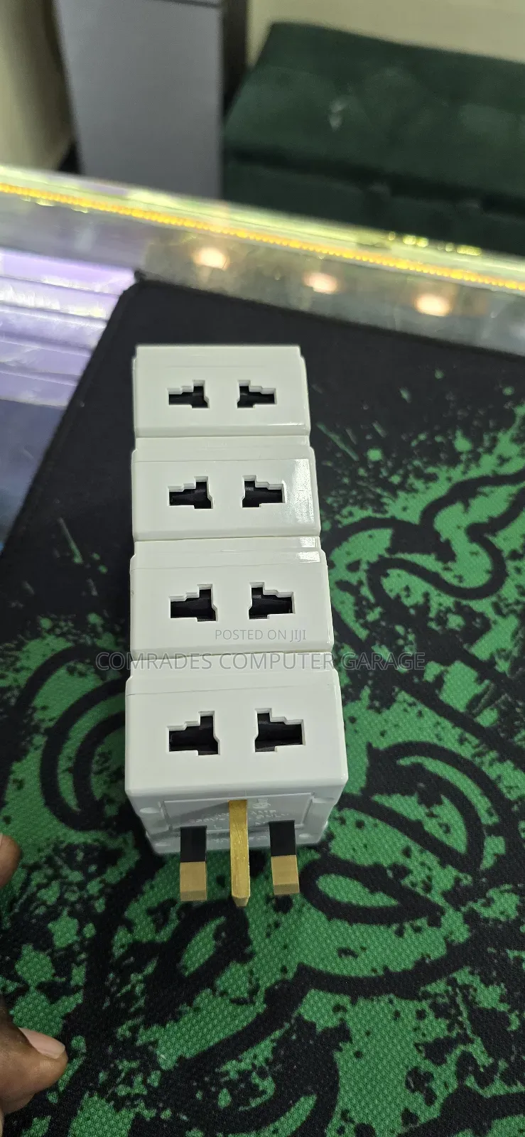 3-Pin Uk Multiplug Adapter Which Also Functions Voltage Protector.