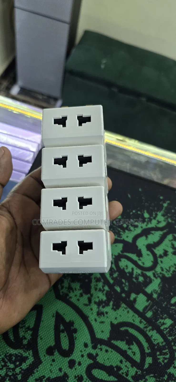 3-Pin Uk Multiplug Adapter Which Also Functions Voltage Protector.